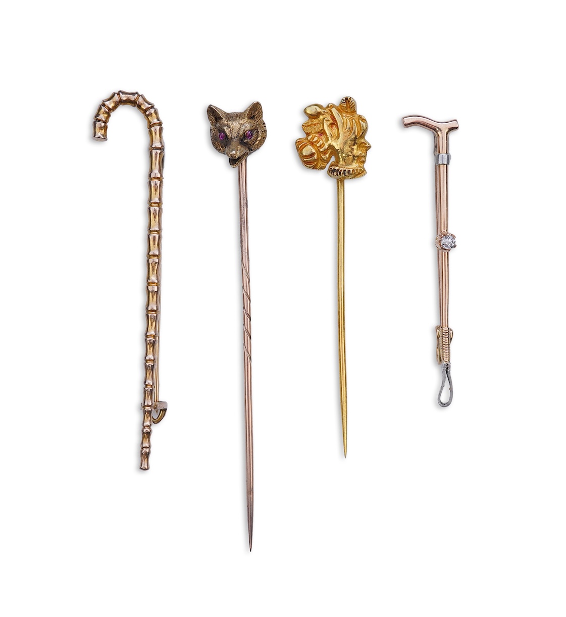 A collection of four tie pins, circa 1900